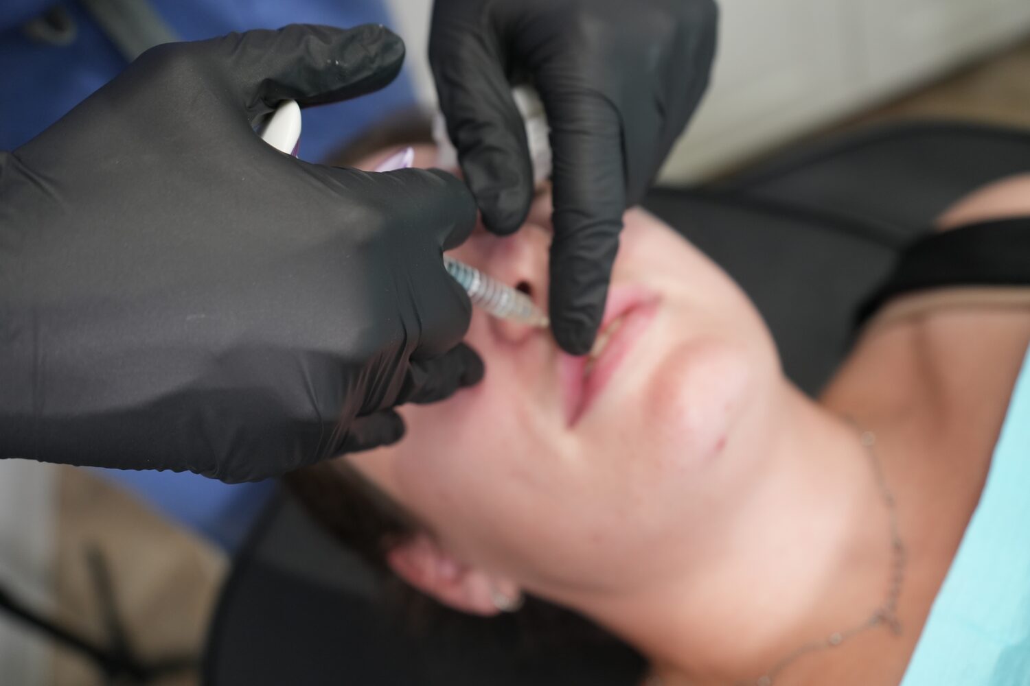 Becci, NMC registered nurse, administering an injectable treatment at The Face Lab