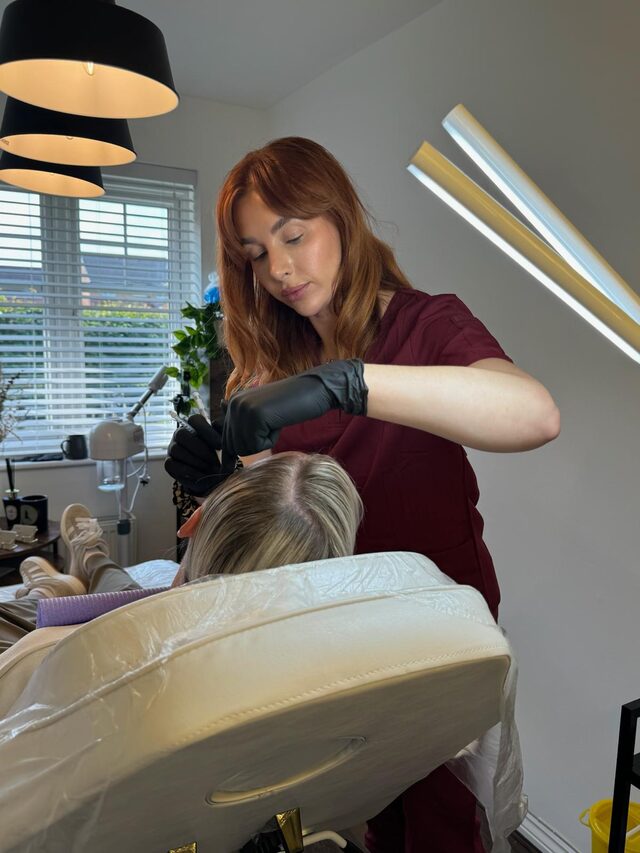 Becci, NMC registered aesthetic nurse and founder of The Face Lab, in blue scrubs